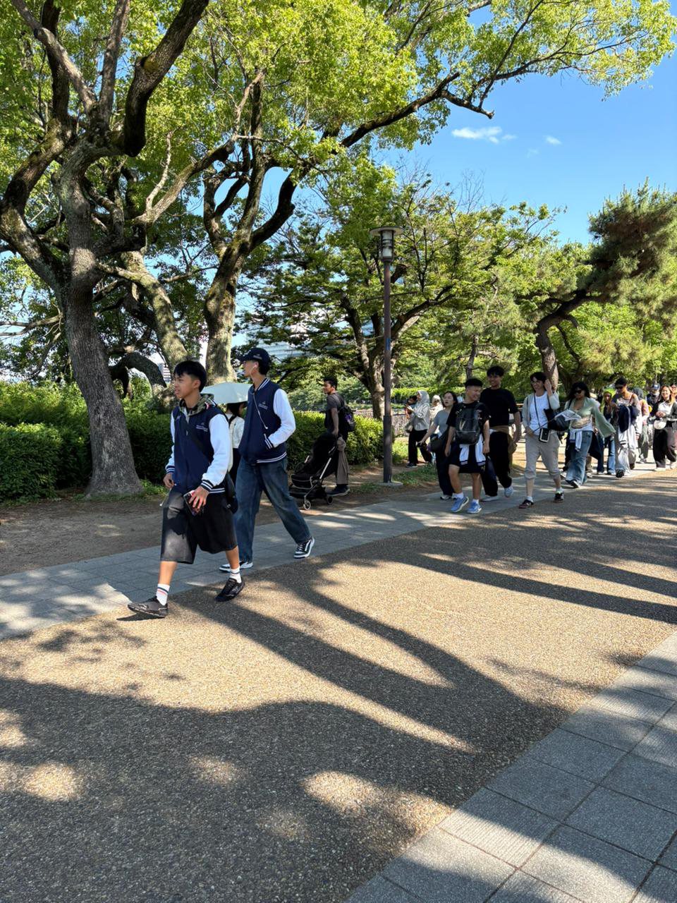 YIS students walking through the Osaka Castle grounds
