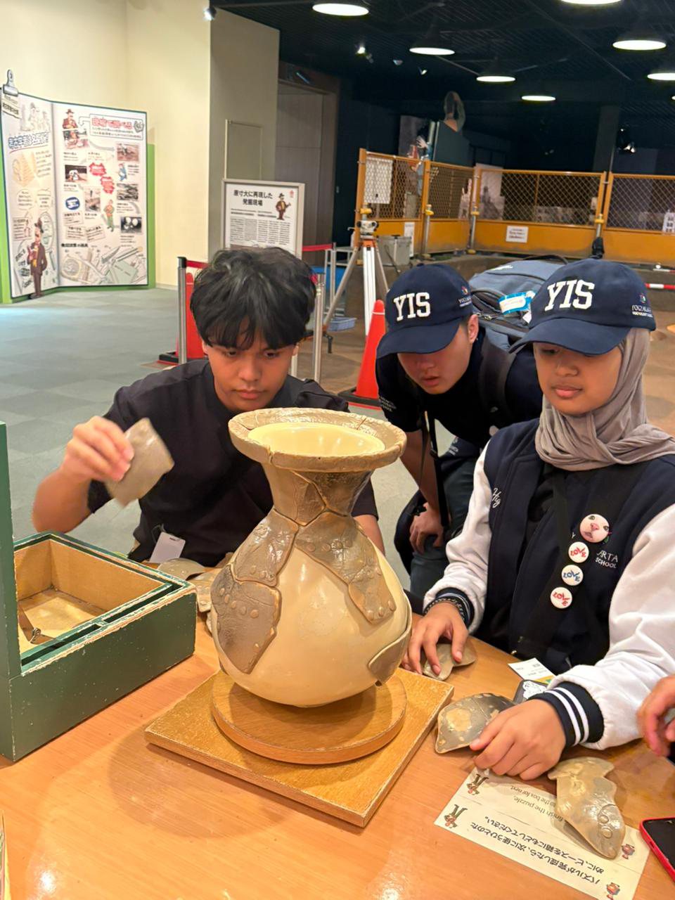 YIS students assembling a pottery activity at Osaka Museum of History
