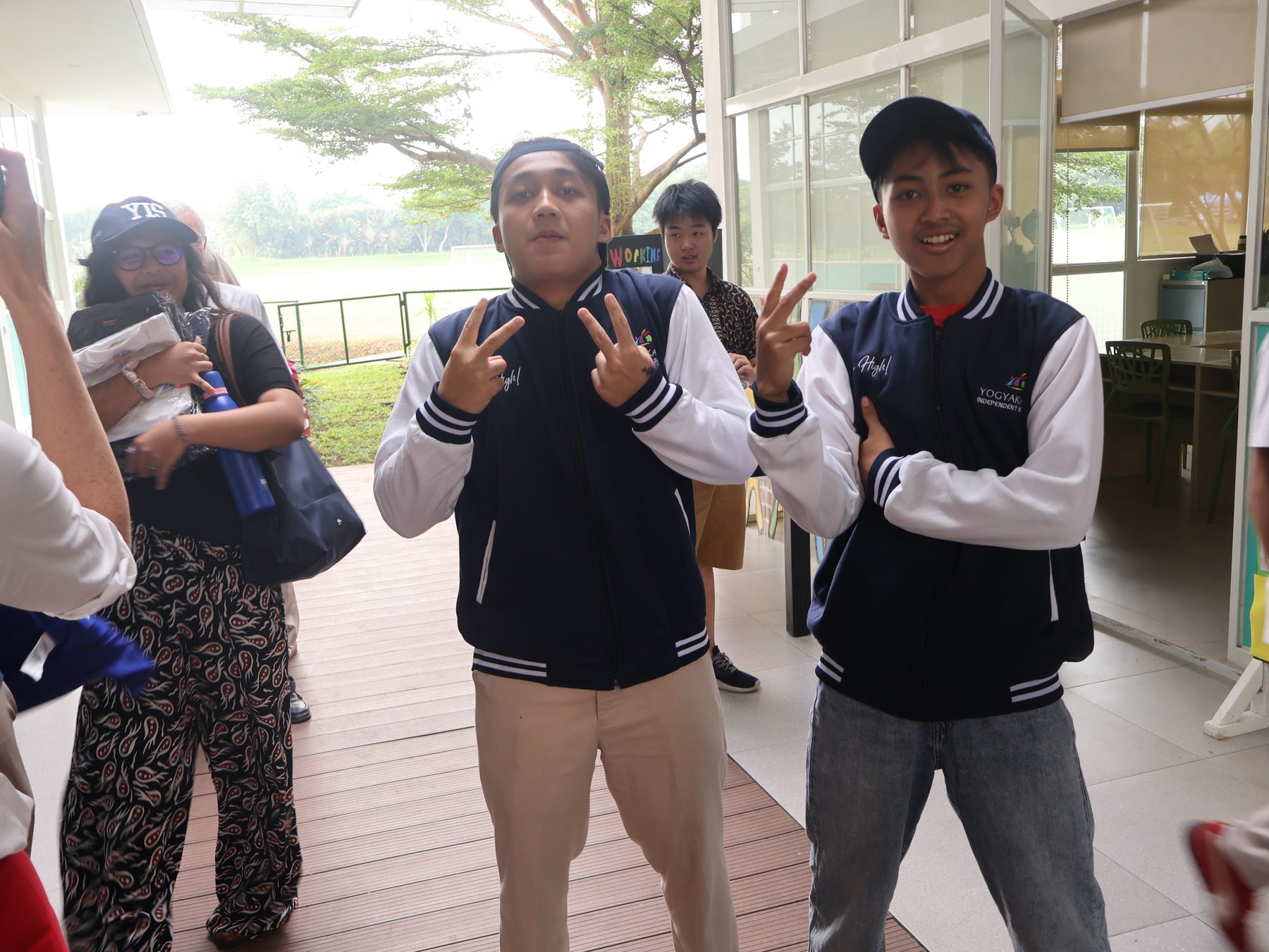 YIS travelers smiling in their journey jackets
